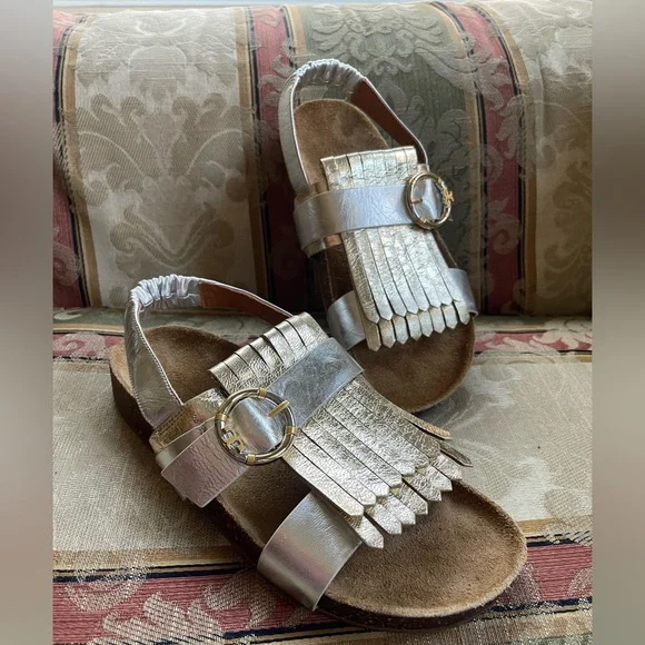 Tory Burch Multi-Logo Kiltie Sandal - Silver / Spark Gold / Natural. Size 7